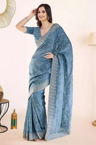 Blue embroidered festive wear saree with matching blouse