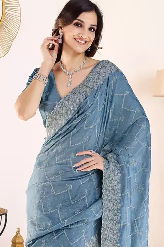 Blue embroidered festive wear saree with matching blouse