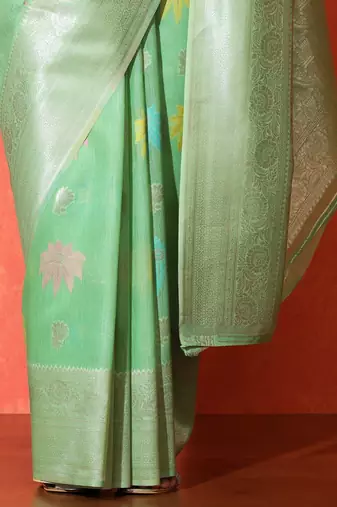 Green woven design saree with blouse