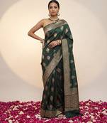 Bottle green katan silk woven saree with blouse