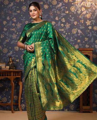 Green ethnic motif woven deisgn zari banarasi saree 1