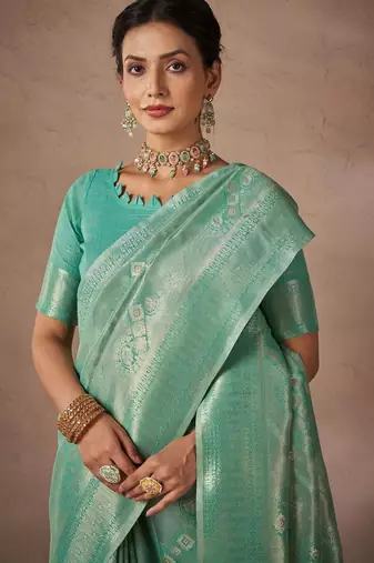 Green woven design sarees with blouse piece