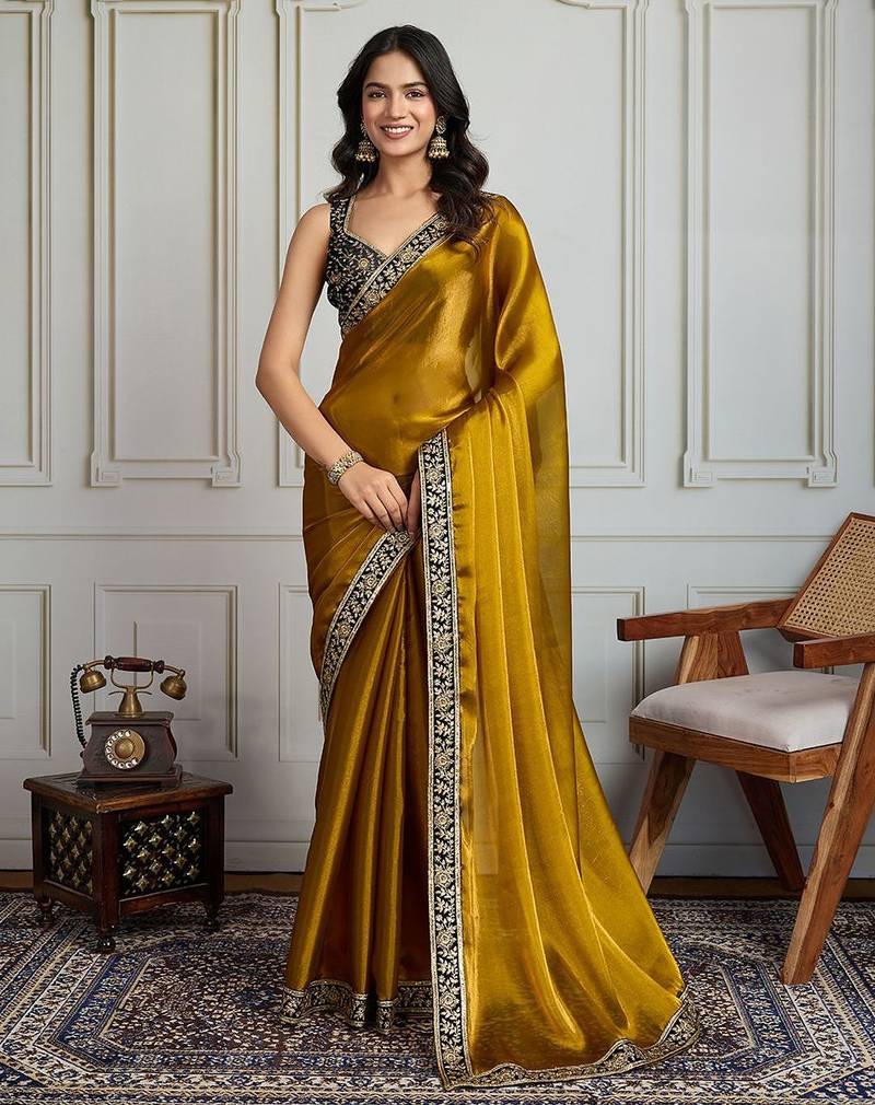 Mustard floral embroidered satin saree with unstitched blouse