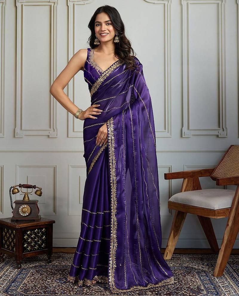 Purple striped sequinned saree with with embroidered border & stitched blouse