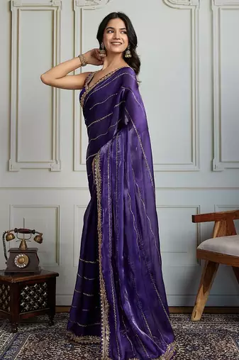Purple striped sequinned saree with with embroidered border & stitched blouse