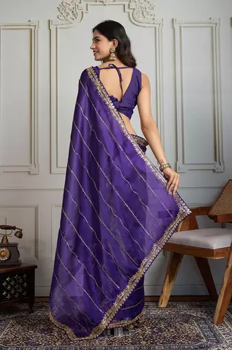 Purple striped sequinned saree with with embroidered border & stitched blouse