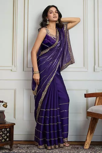 Purple striped sequinned saree with with embroidered border & stitched blouse