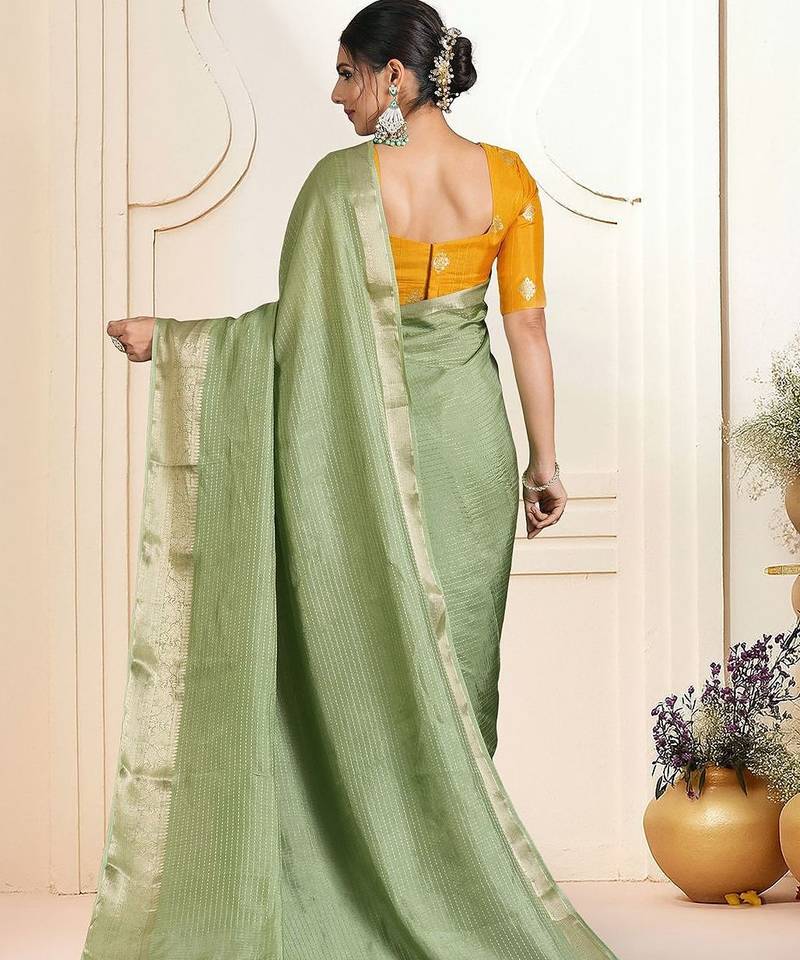 Green ethnic woven design zari saree