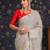 Grey ethnic woven design banarasi saree with unstitched blouse