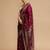 Maroon woven design banarasi saree with unstitched blouse