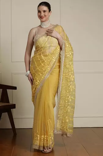 Yellow women ethnic motifs embroidered saree