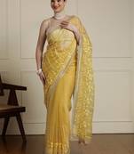 Yellow women ethnic motifs embroidered saree