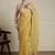 Yellow women ethnic motifs embroidered saree