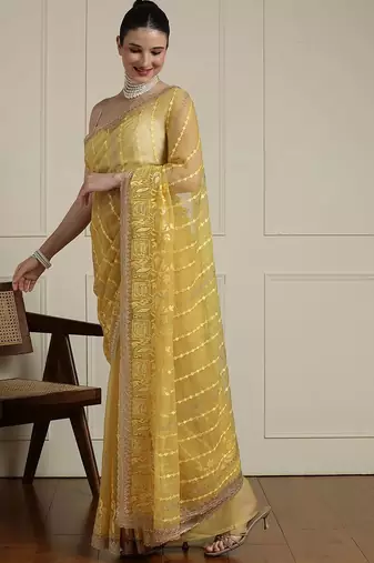 Yellow women ethnic motifs embroidered saree