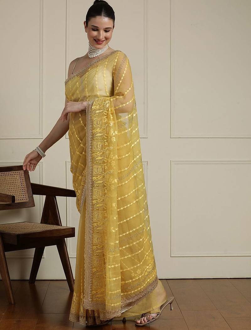 Yellow women ethnic motifs embroidered saree
