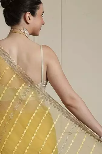 Yellow women ethnic motifs embroidered saree