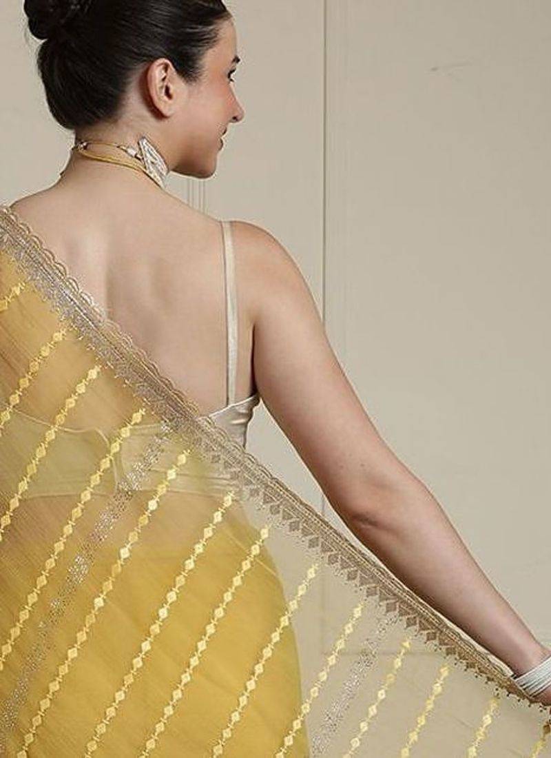Yellow women ethnic motifs embroidered saree