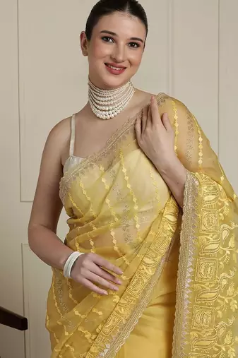Yellow women ethnic motifs embroidered saree