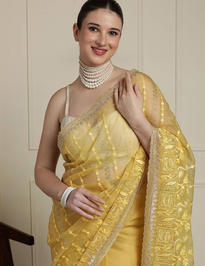 Yellow women ethnic motifs embroidered saree