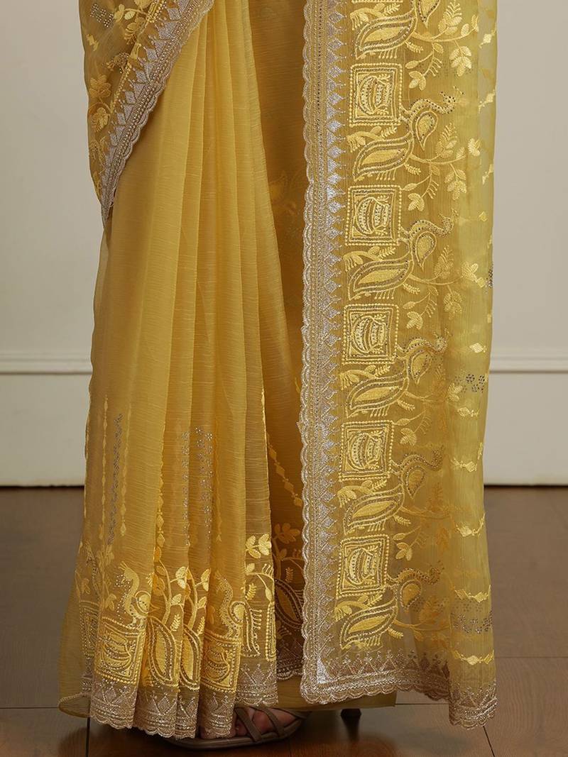 Yellow women ethnic motifs embroidered saree