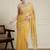 Yellow ethnic motifs embroidered scallop zari border saree