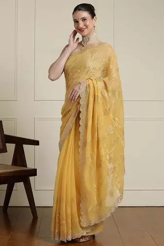 Yellow ethnic motifs embroidered scallop zari border saree