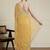 Yellow ethnic motifs embroidered scallop zari border saree