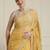 Yellow ethnic motifs embroidered scallop zari border saree