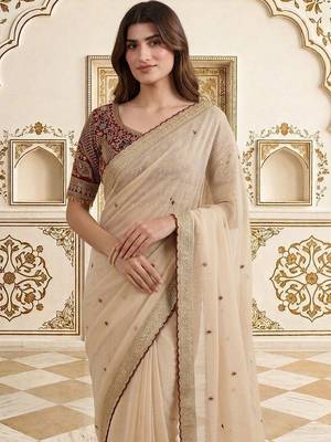 Cream embellished embroidered saree 1