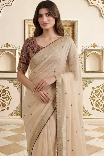 Cream embellished embroidered saree