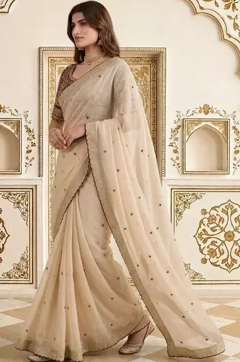 Cream embellished embroidered saree