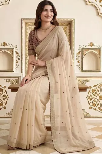 Cream embellished embroidered saree