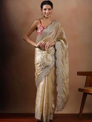 Cream embroidered organza sarees 1