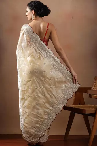 Cream embroidered organza sarees