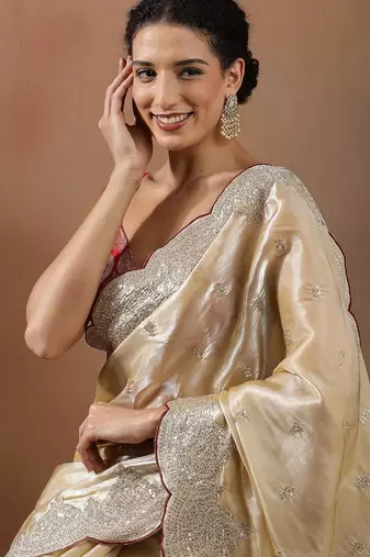 Cream embroidered organza sarees