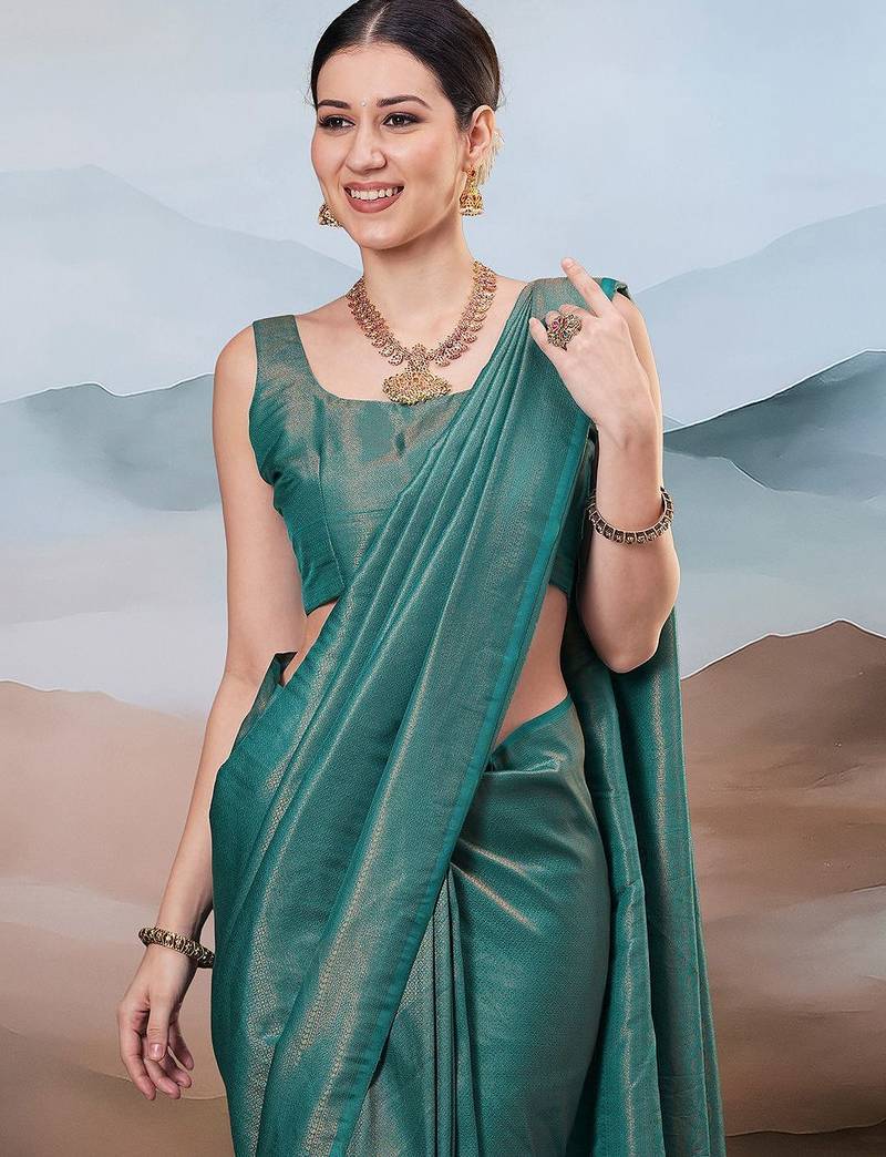Teal ethnic woven design saree with matching blouse