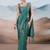 Teal ethnic woven design saree with matching blouse