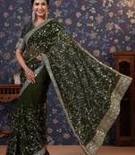 Green sequinned embellished saree with blouse piece