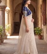 Off white saree with embroidered blouse