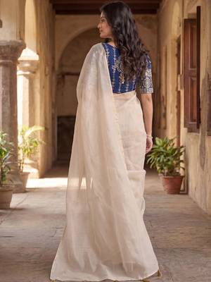 Off white saree with embroidered blouse 2