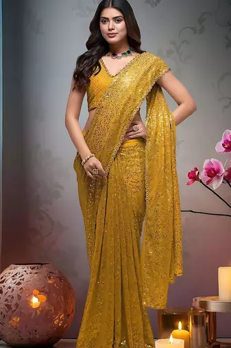 Yellow embroidered embellished saree with unstitched blouse piece