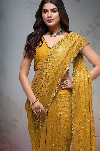 Yellow embroidered embellished saree with unstitched blouse piece