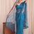 Teal floral sequinned net designer saree