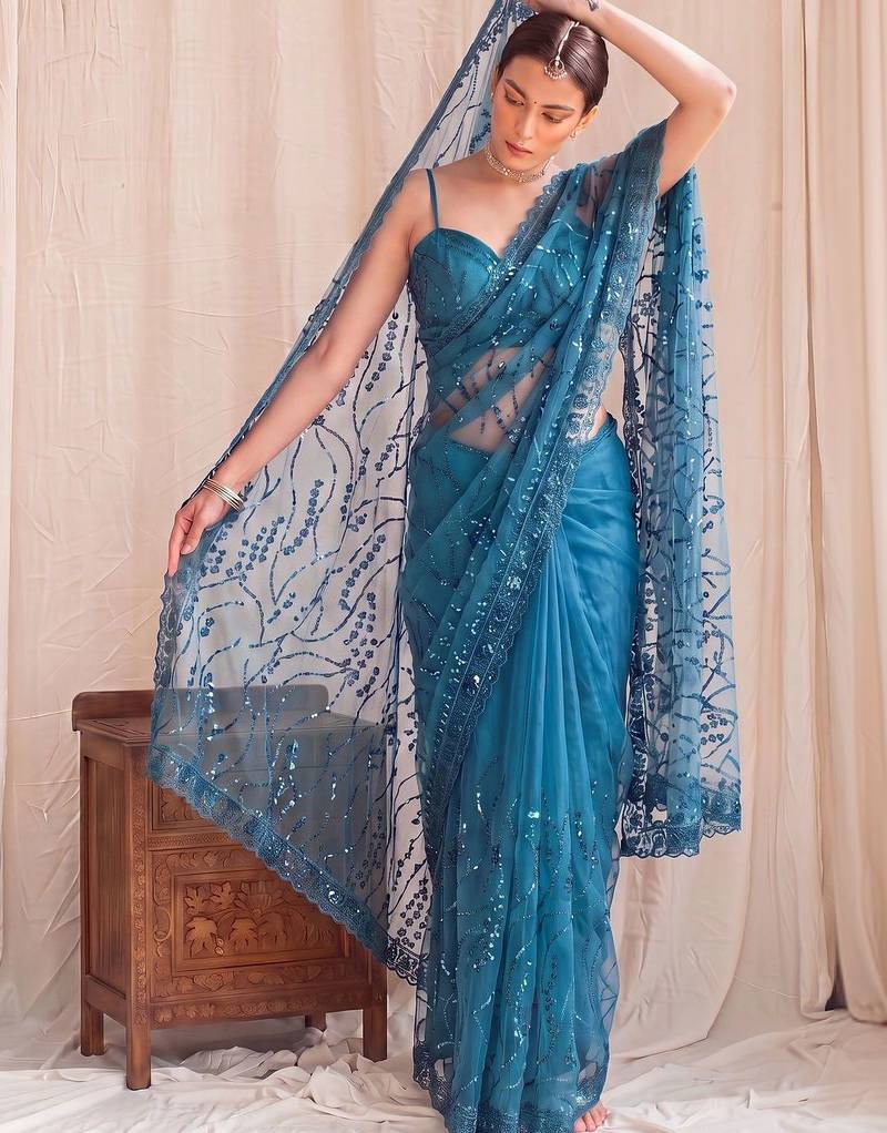 Teal floral sequinned net designer saree