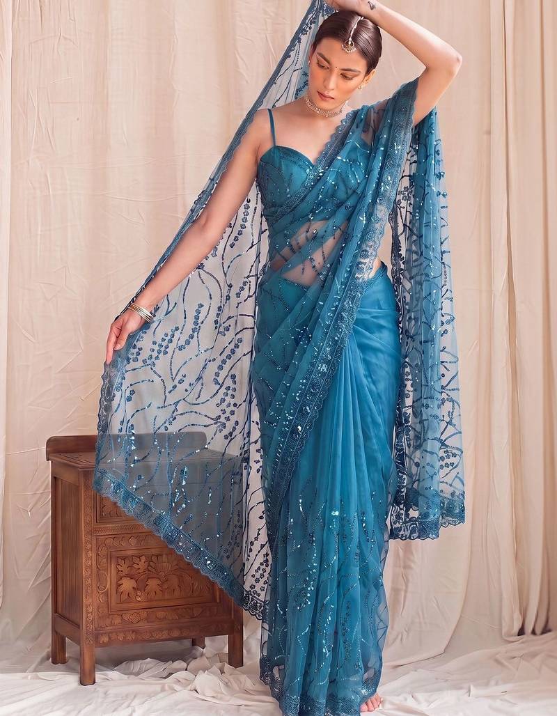 Teal floral sequinned net designer saree