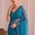 Teal floral sequinned net designer saree