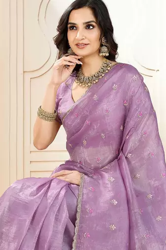 Purple ethnic embroidered festive wear saree with matching blouse