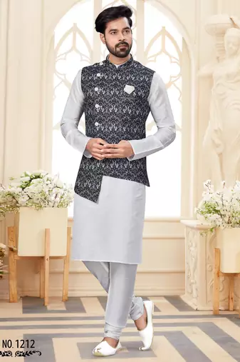 Maroon kurta and trousers paired with blue waistcoat featuring an intricate red pattern, gold-tone buttons