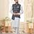 Maroon kurta and trousers paired with blue waistcoat featuring an intricate red pattern, gold-tone buttons