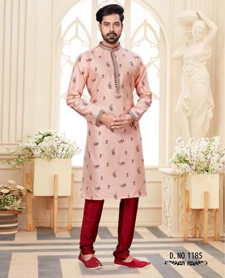 A soft peach kurta with scattered red floral motifs and striped detailing along the collar, placket, and cuffs 1